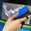 Blue Squeegee being used to install decal thumbnail